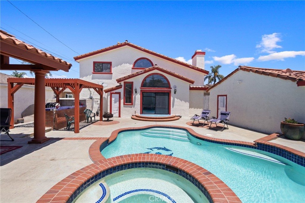 a front view of a house with swimming pool