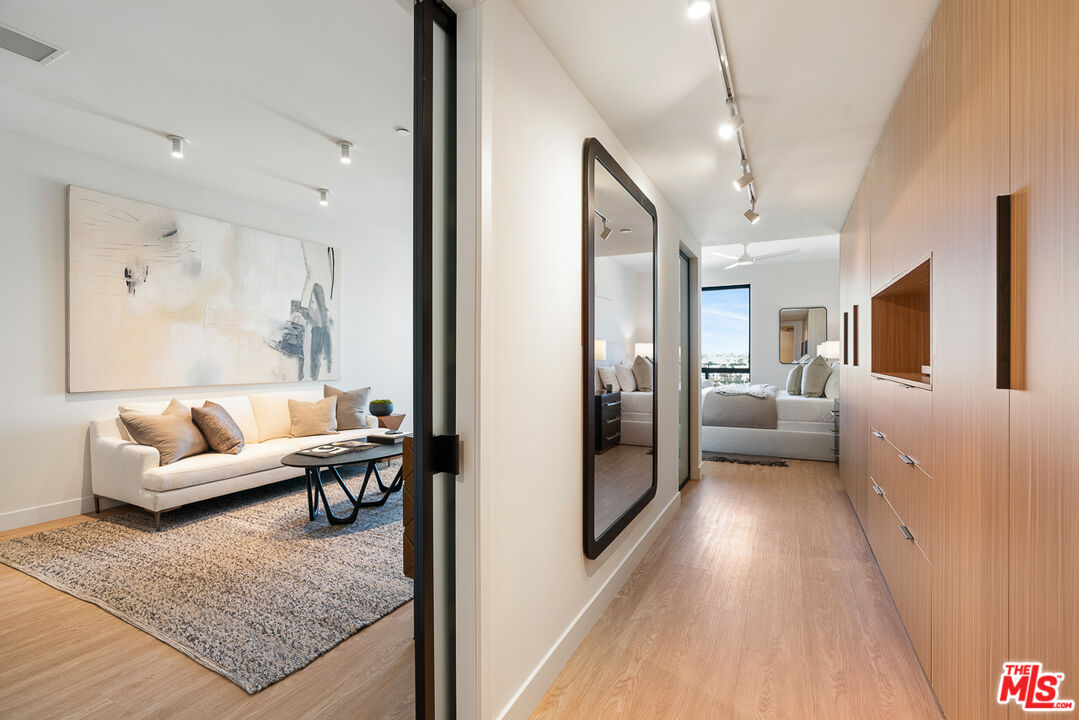 a living room with furniture and a rug