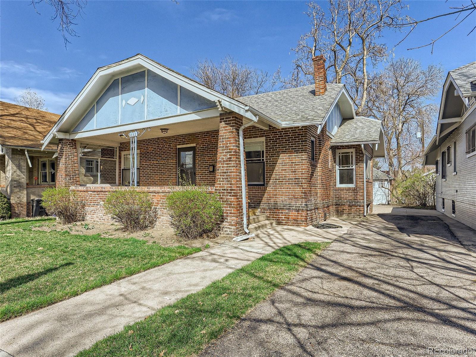 a front view of a house with yard