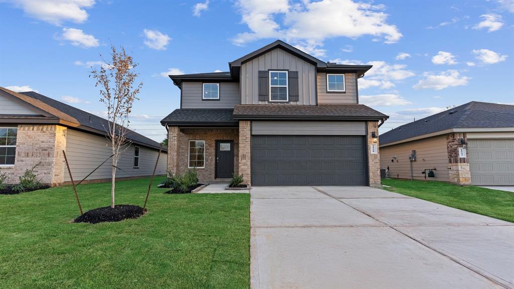 front view of a house with a yard