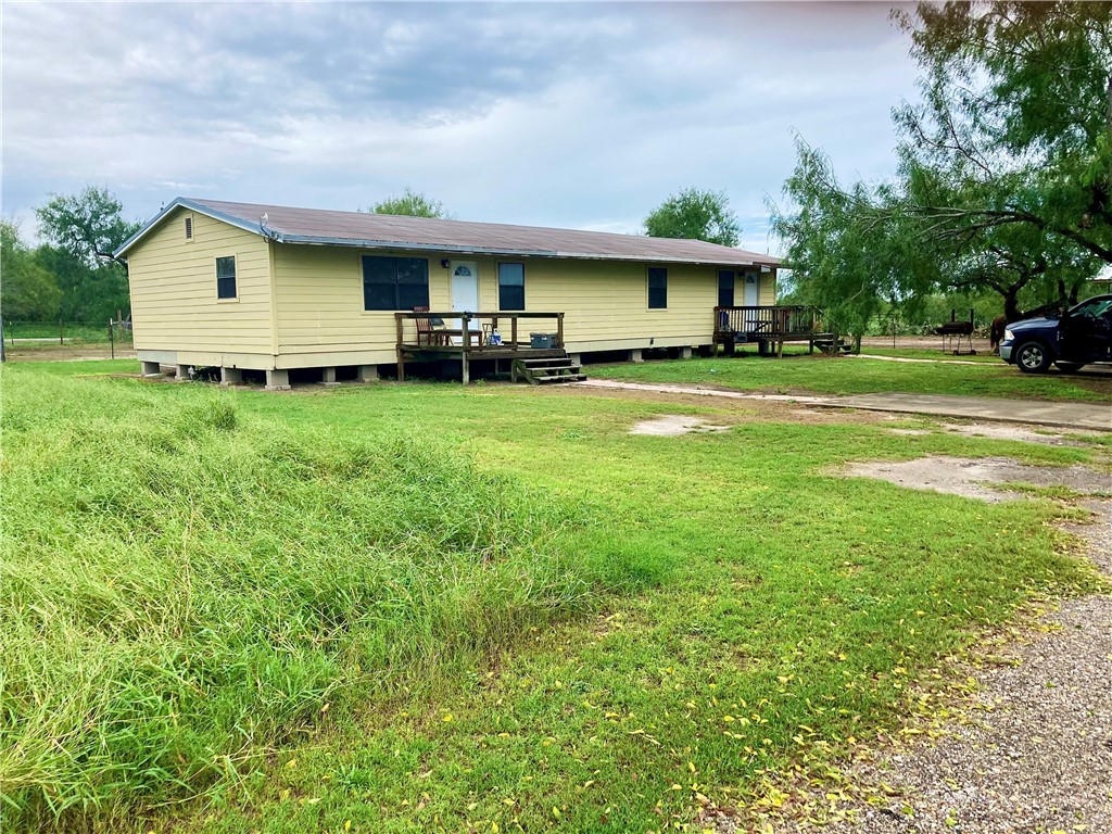 a front view of house with yard having outdoor seating