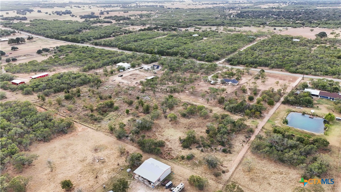 an aerial view of houses with yard