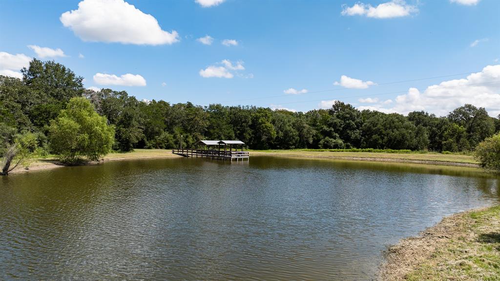 a view of swimming pool with lake view and mountain view