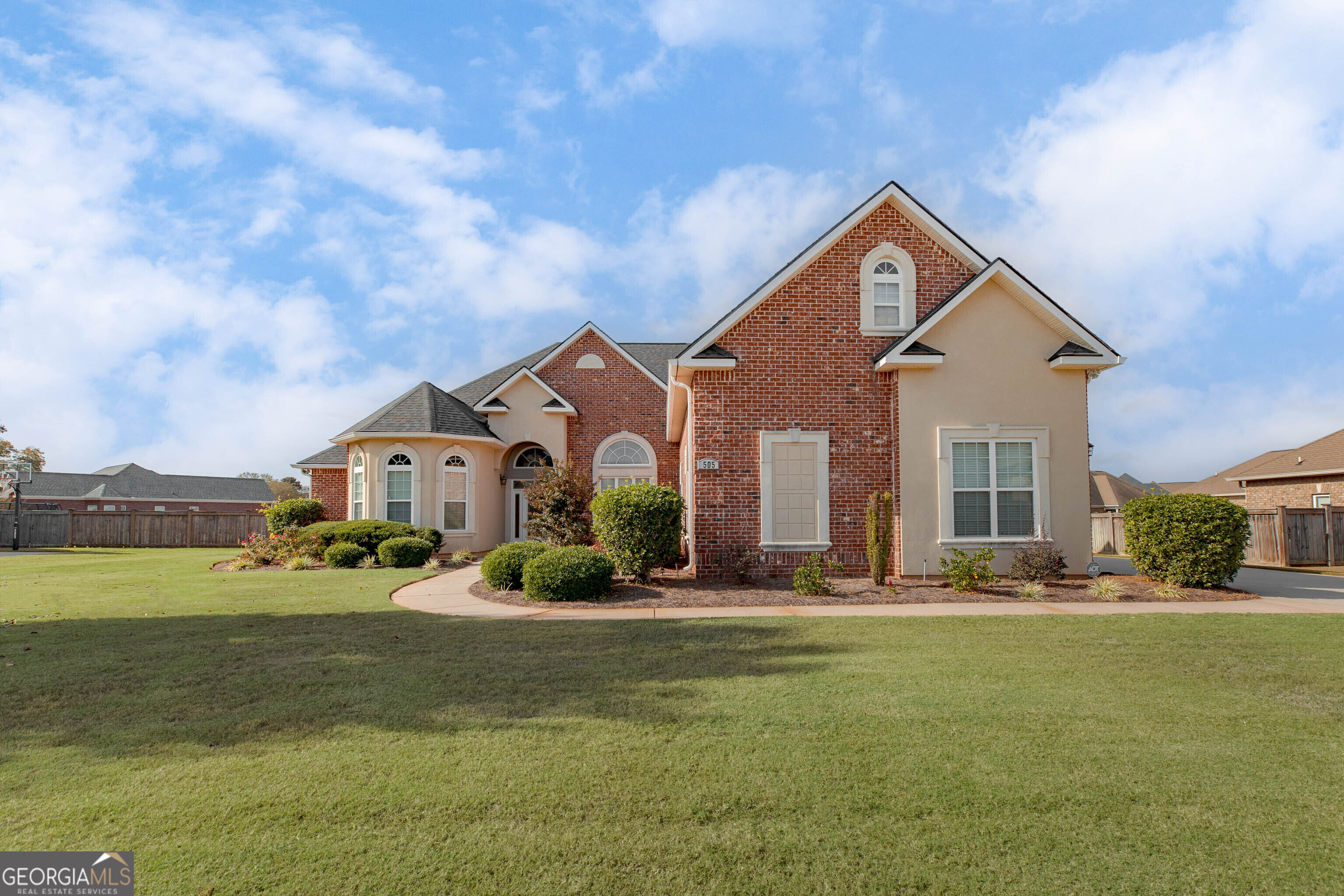 a front view of a house with a yard