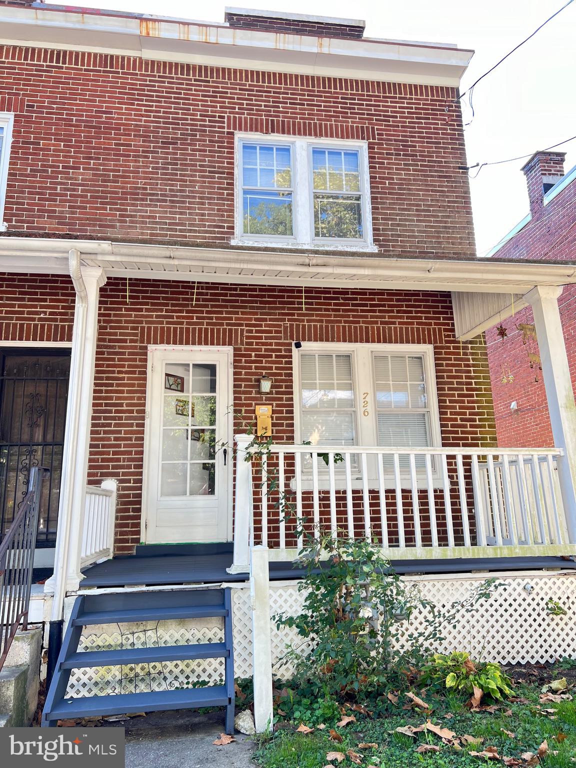 a view of a house with a bench