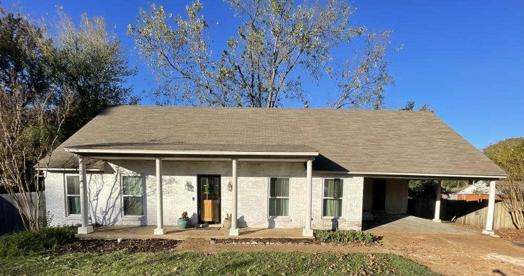 front view of a house with a yard