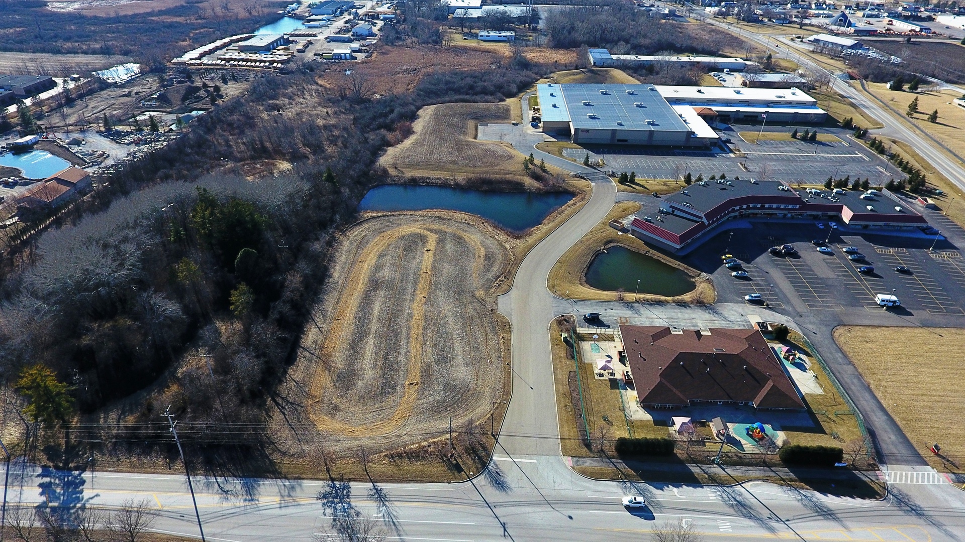 an aerial view of a house with outdoor space