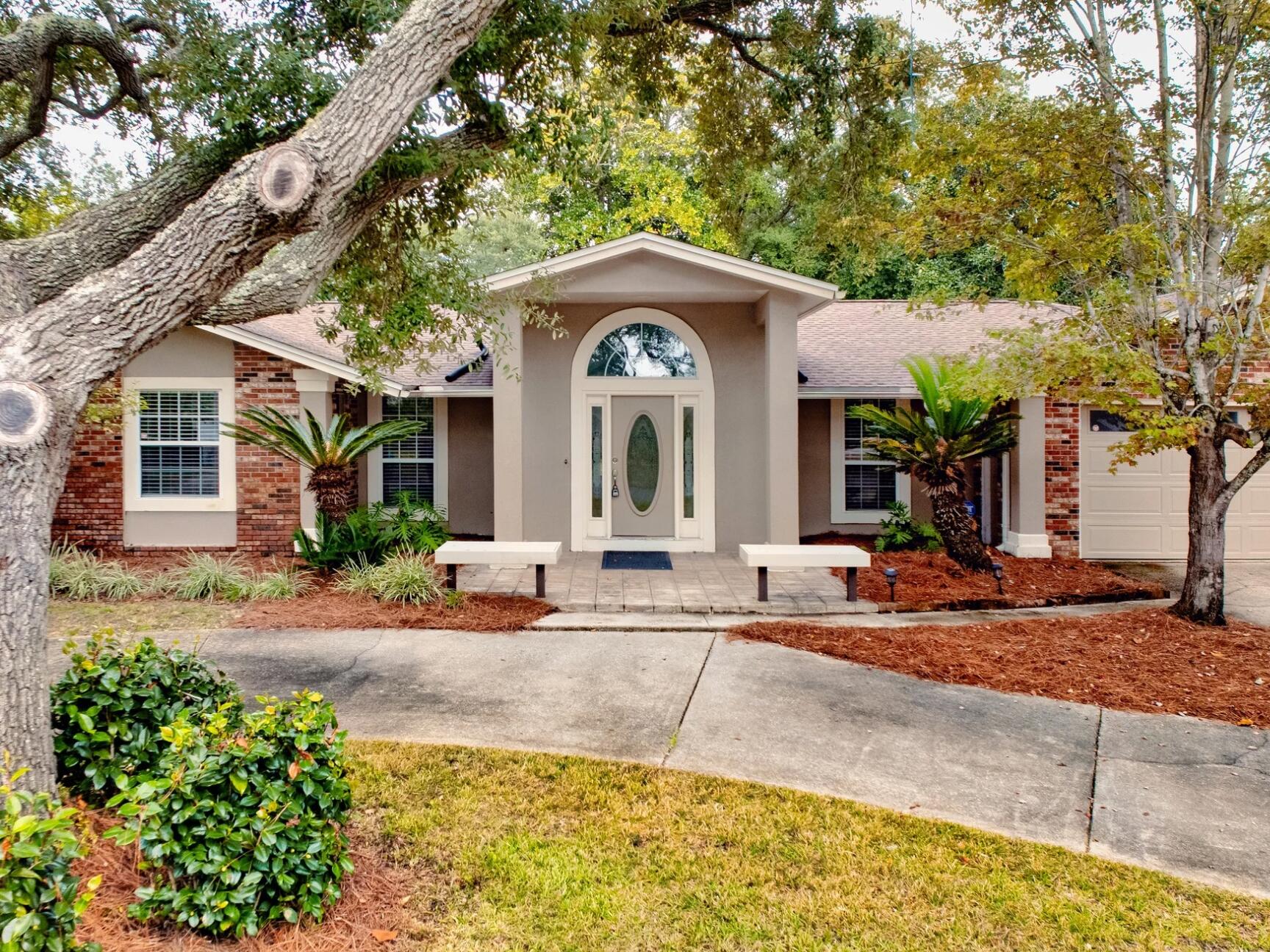 a front view of a house with garden