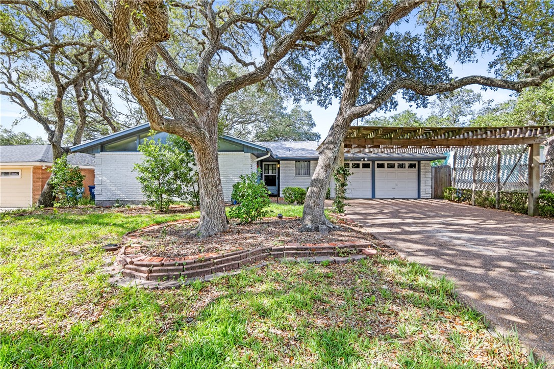 a house with trees in front of it