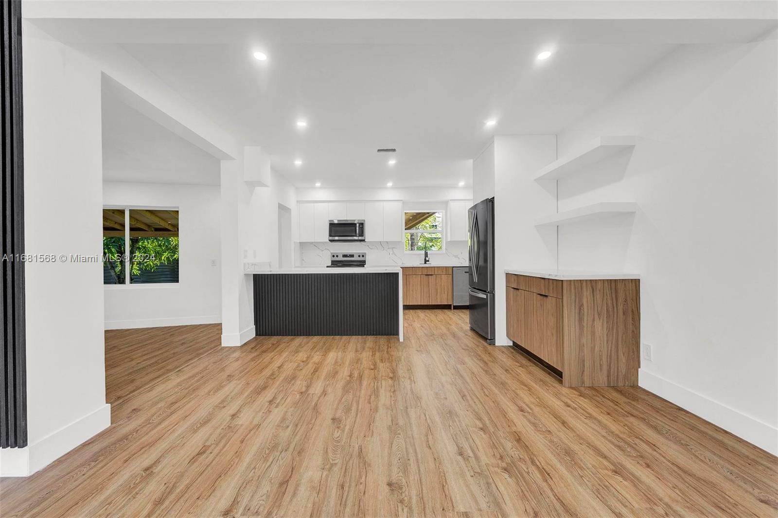 a view of kitchen with wooden floor