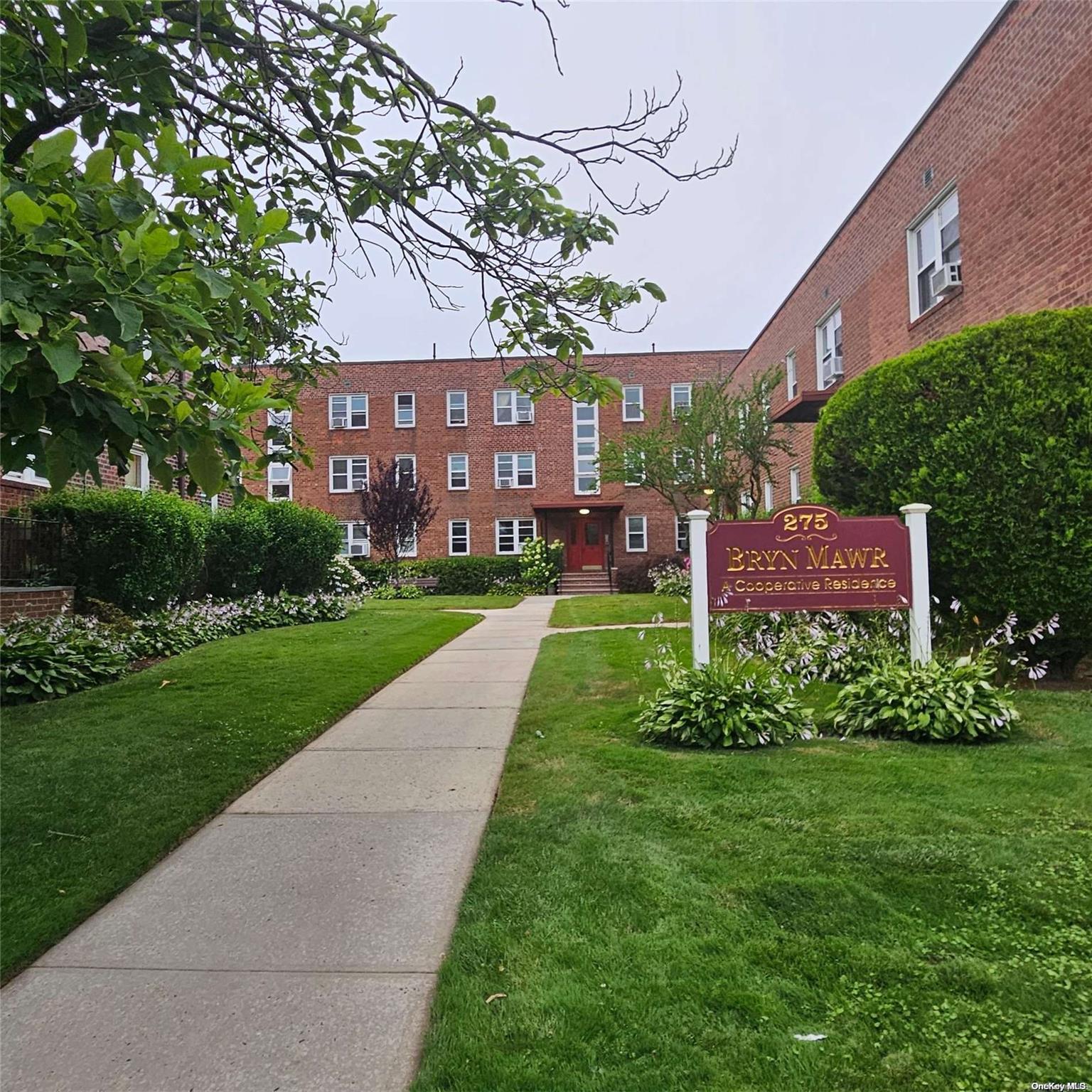 a view of a building with a yard