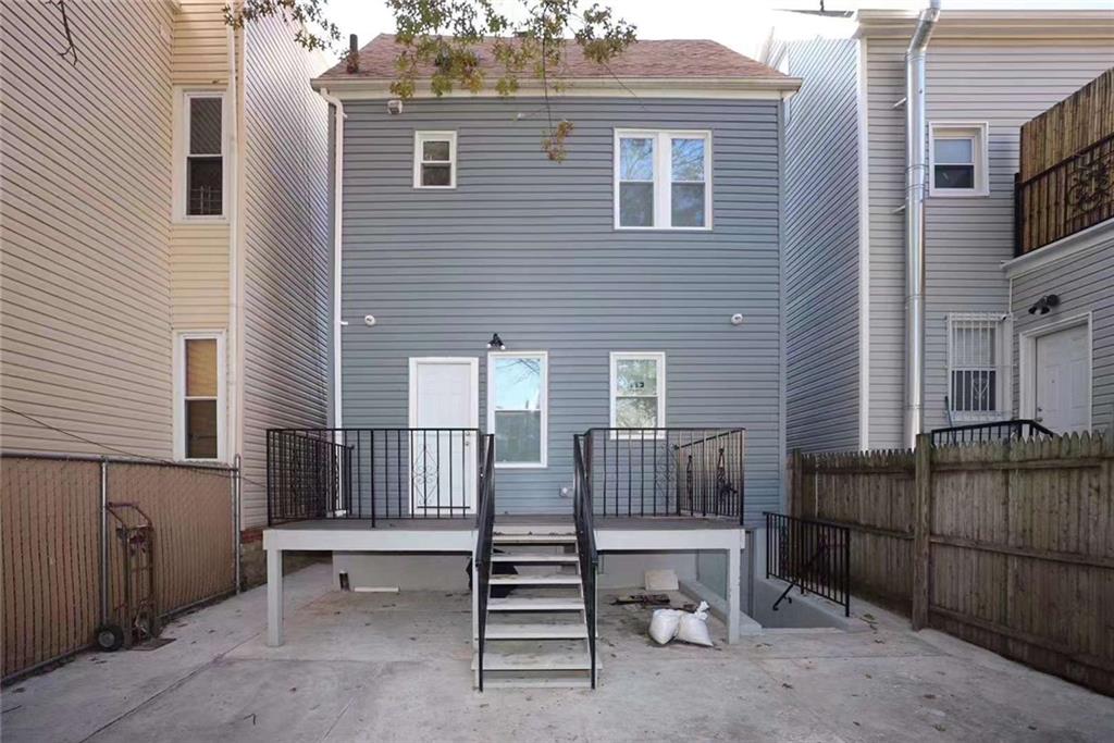 a view of backyard with barbeque and outdoor seating