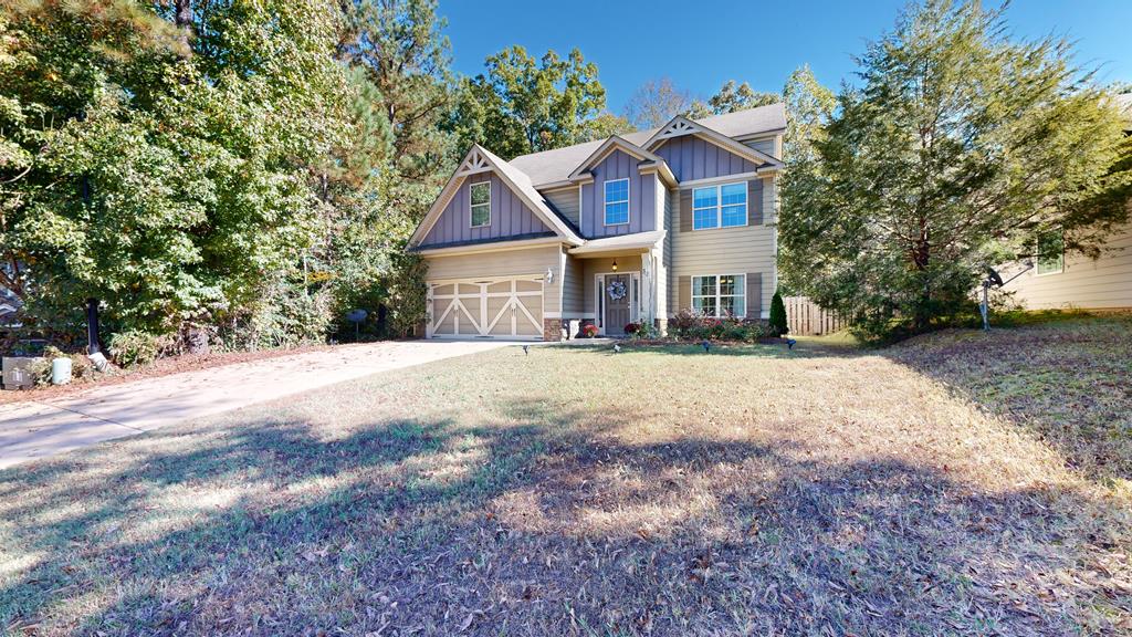 a front view of a house with a yard