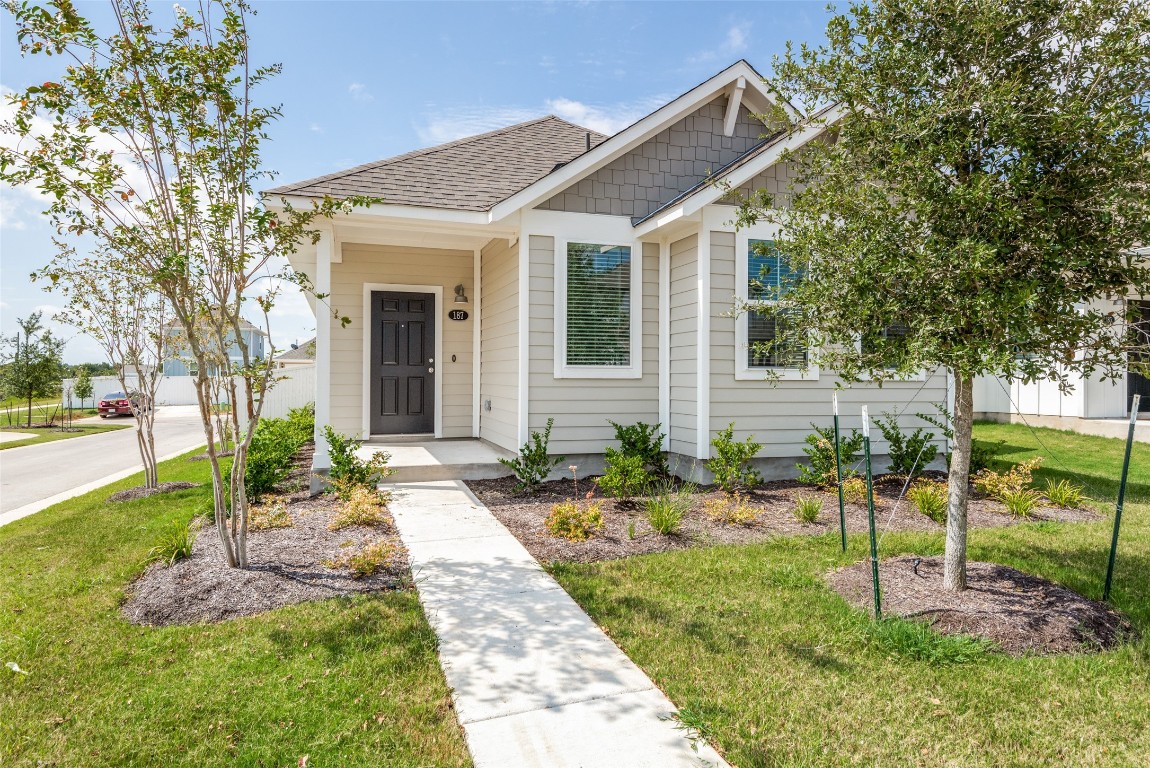 a front view of a house with a yard