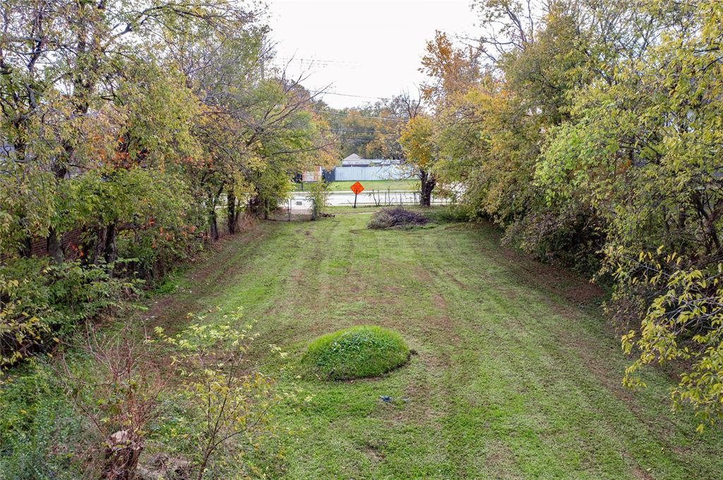 a view of a tiny house with a yard