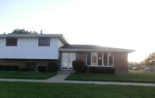 a view of house with backyard outdoor seating and hardwood