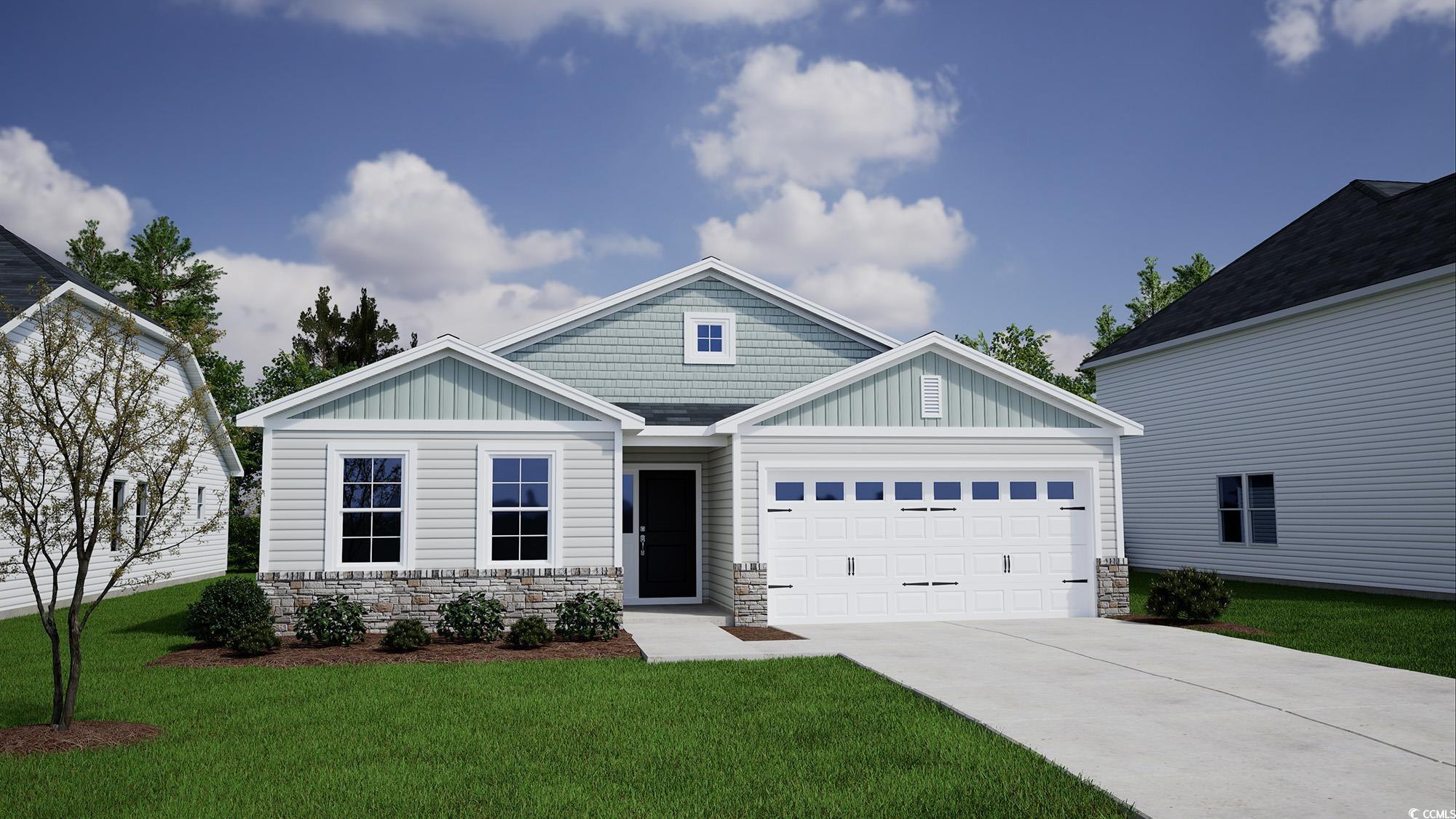 Craftsman house featuring a garage and a front law