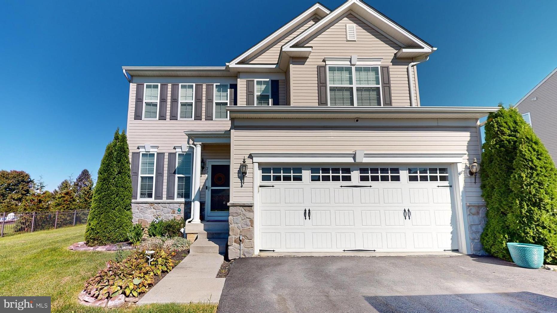 front view of a house with a yard