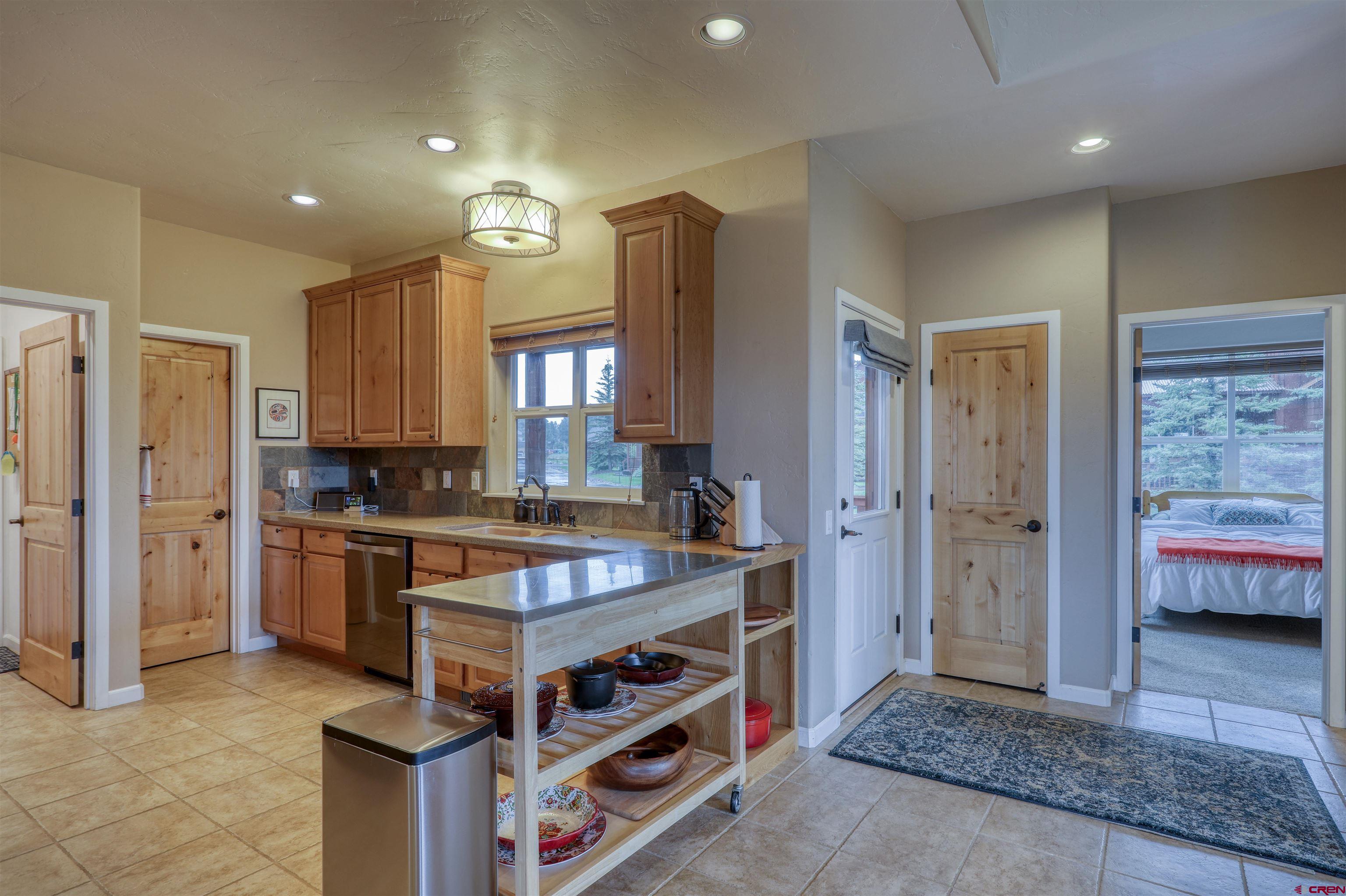 a kitchen with a stove and a sink