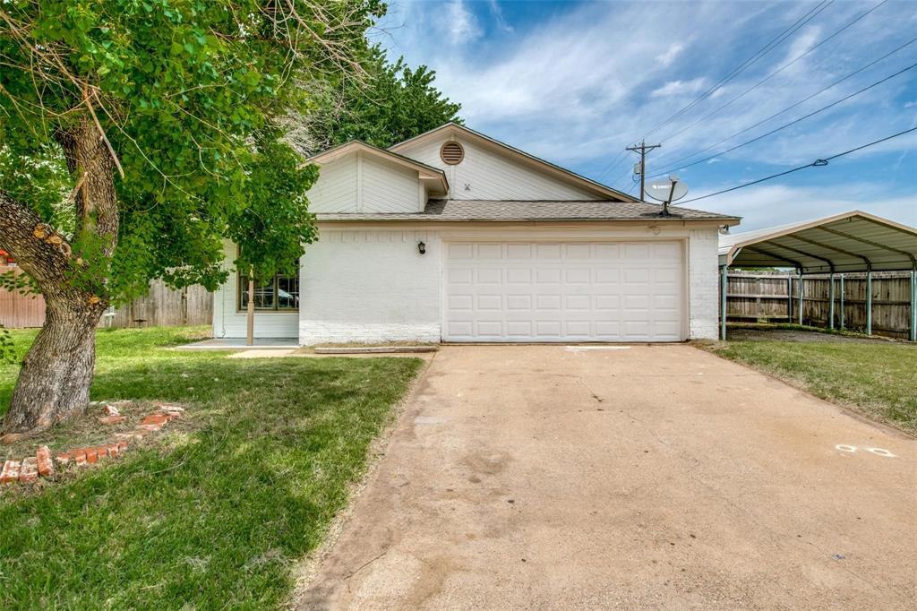 a front view of a house with yard