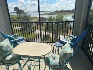 a view of a chairs and table in the balcony