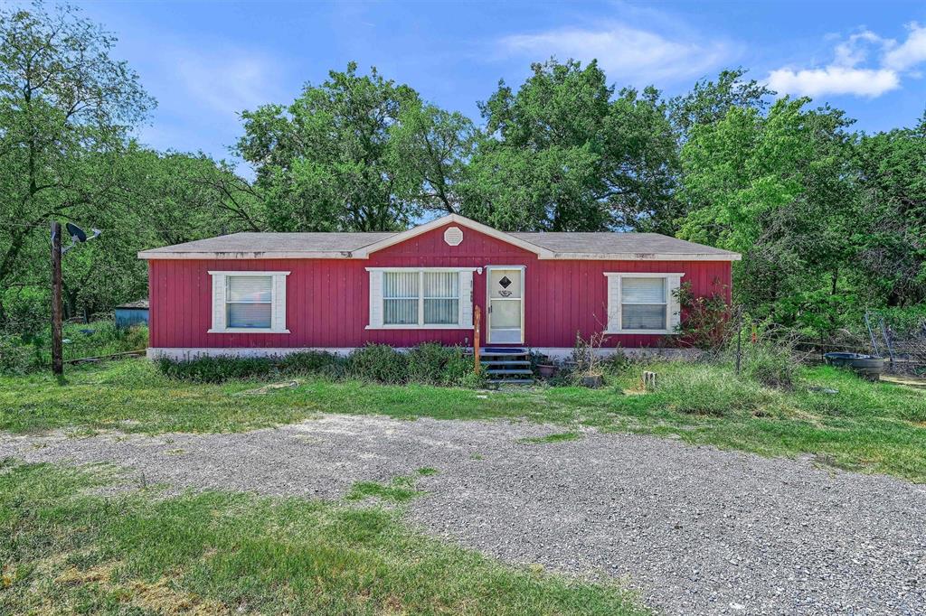 a view of a yard in front of a house with a yard