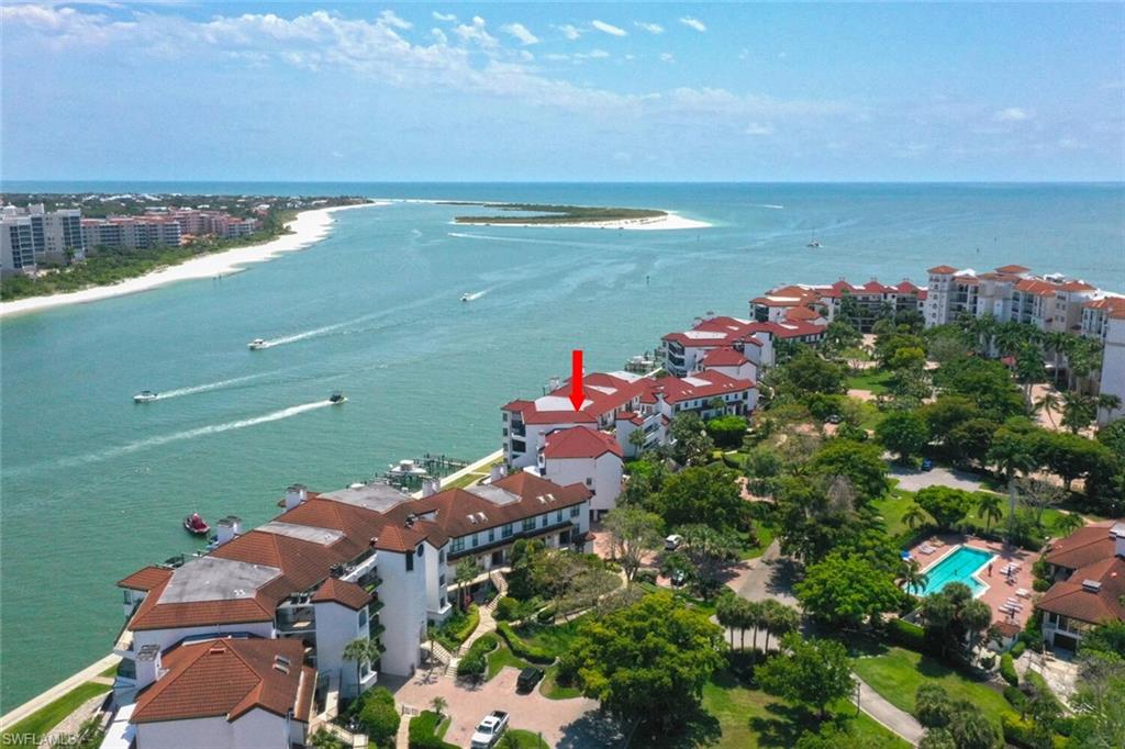 Aerial view featuring a view of the beach and a water view