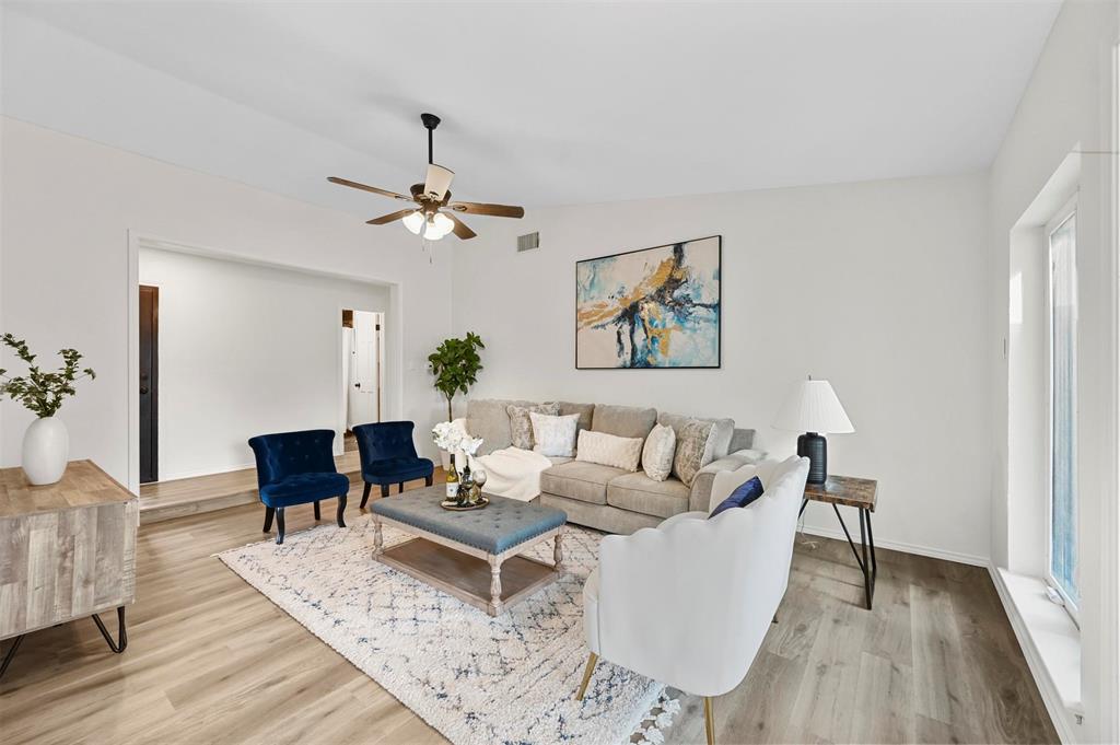 a living room with furniture and a table