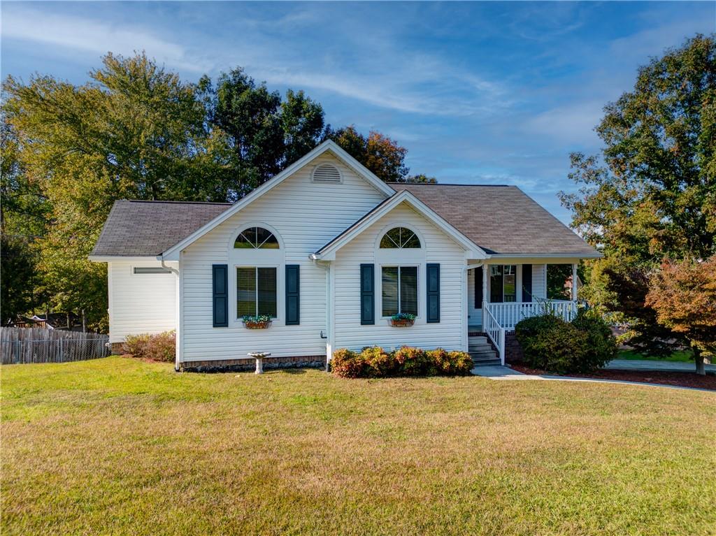 a front view of a house with a yard