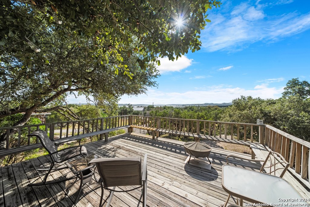 a view of a chairs and table on the deck