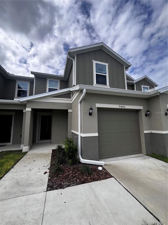 a front view of a house with garage