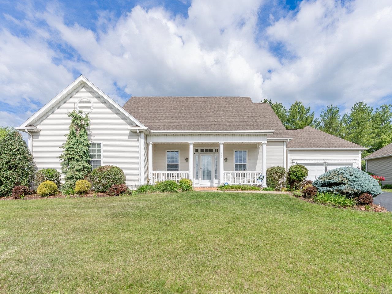 a front view of a house with a yard