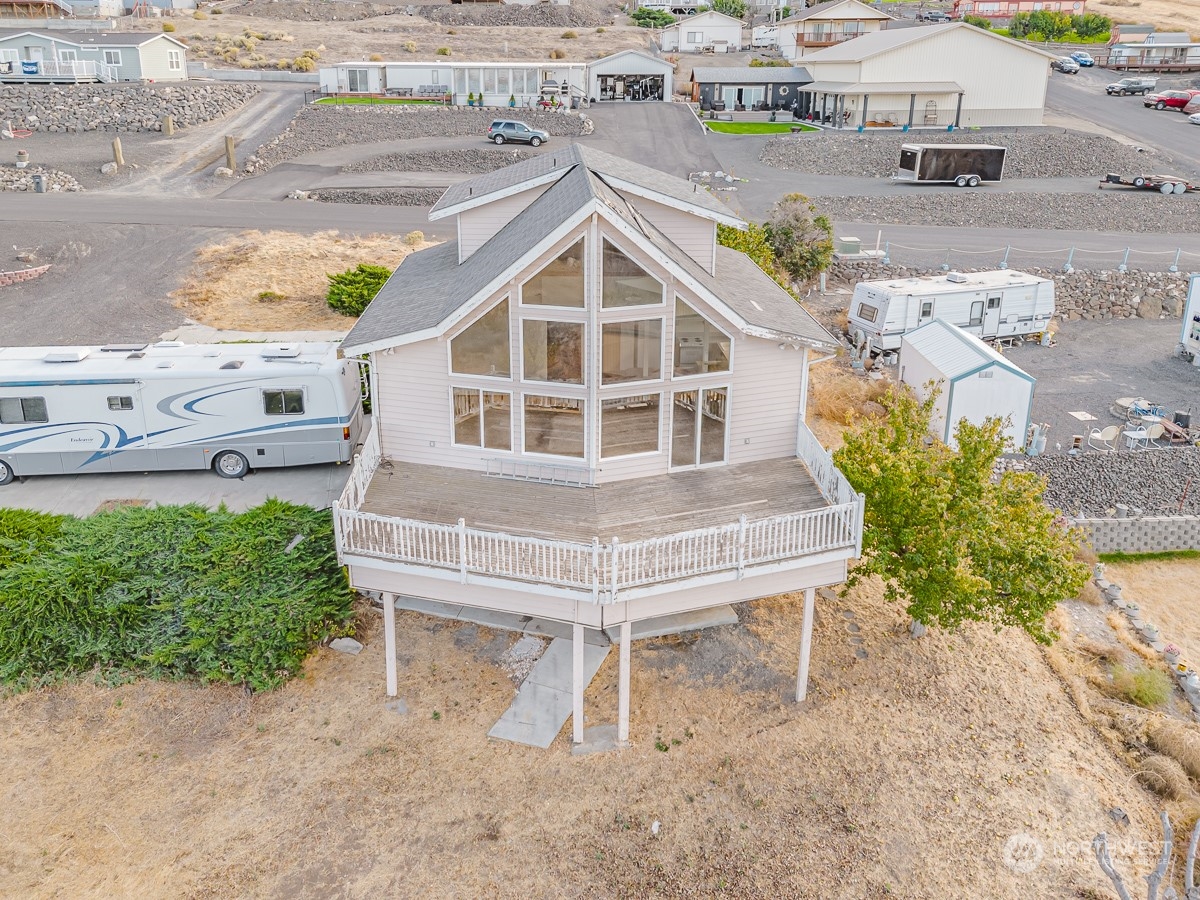 an aerial view of a house with a yard