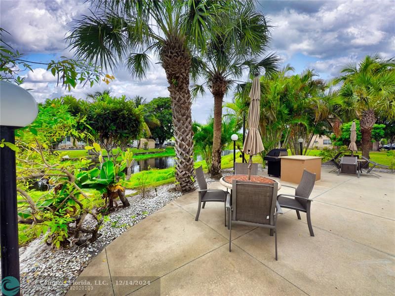 a view of a chairs and table in the garden