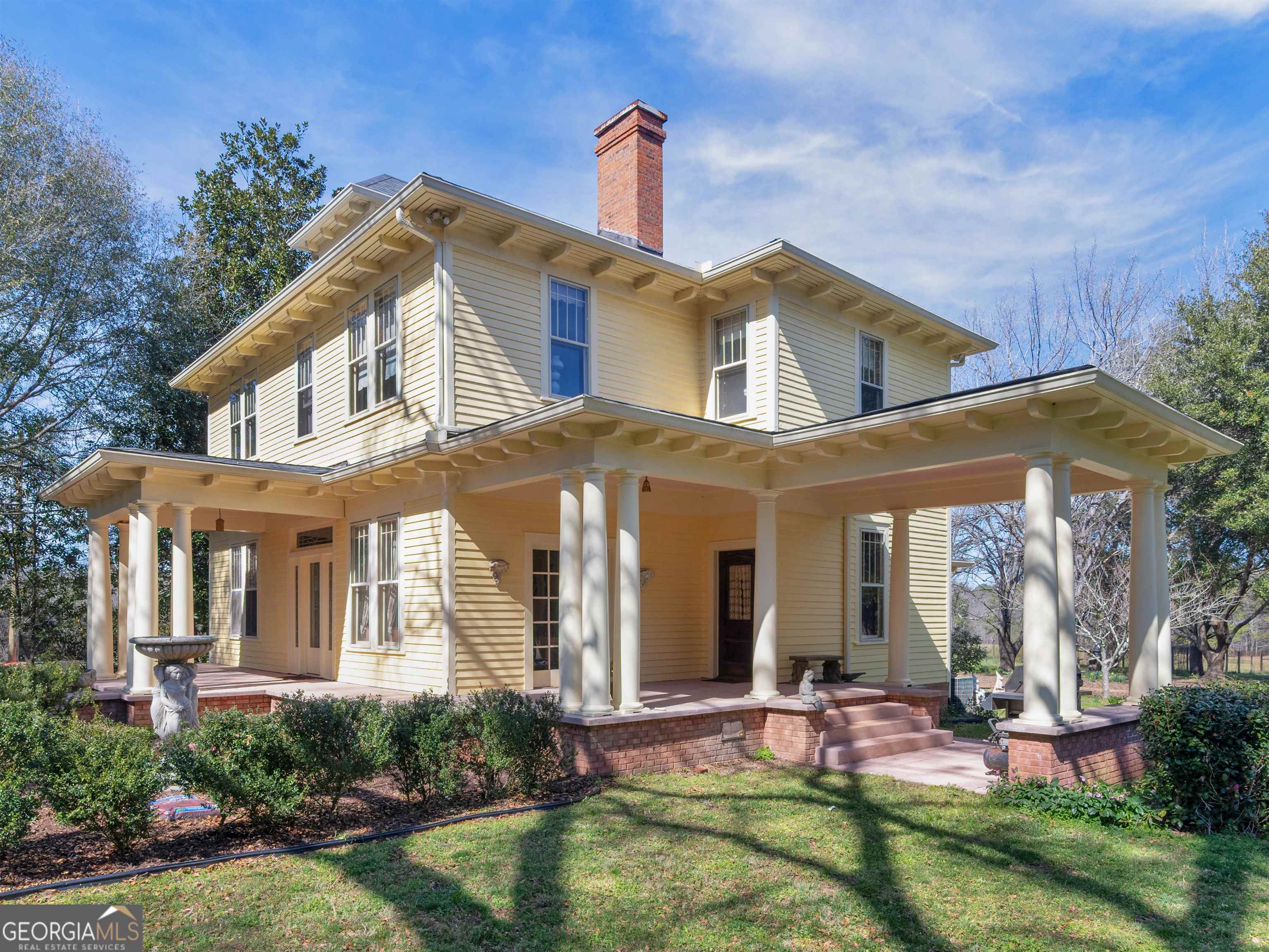 a front view of a house with garden