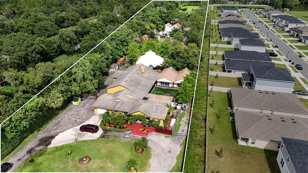 an aerial view of a house a yard and mountain view