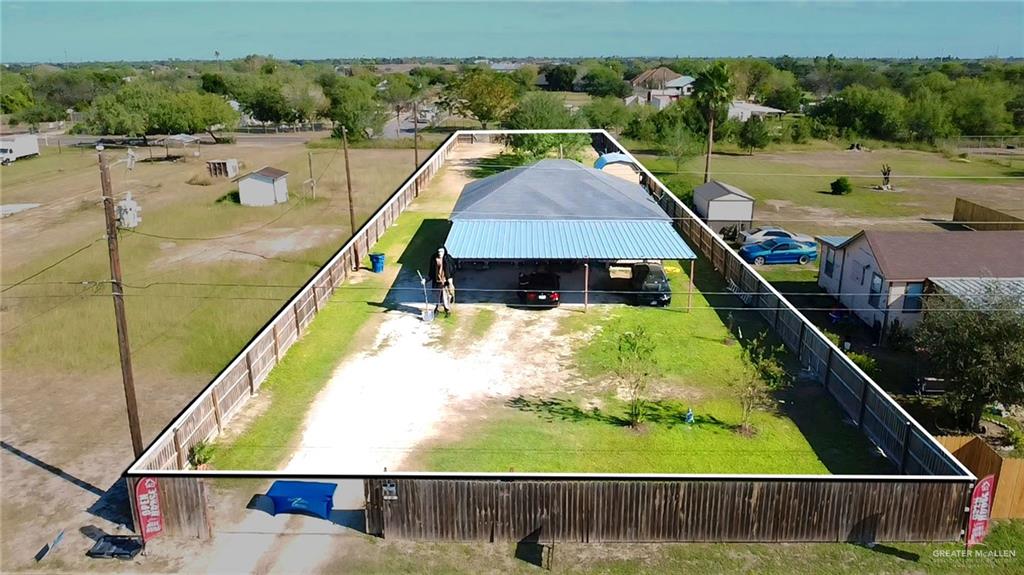 a aerial view of a house with a yard