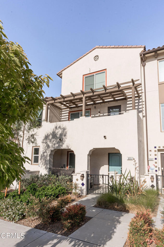 a front view of a building with garden