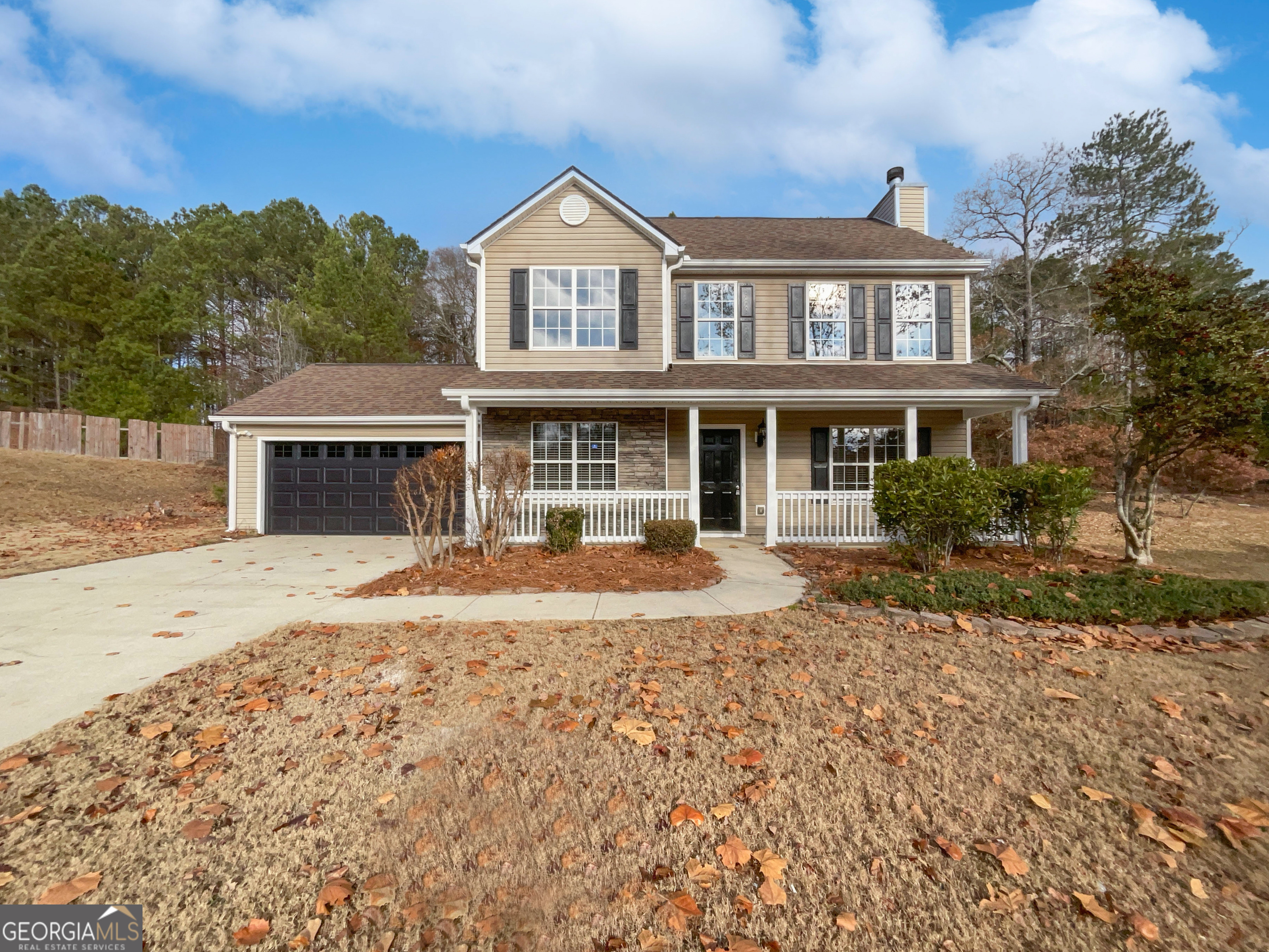 front view of a house with a yard