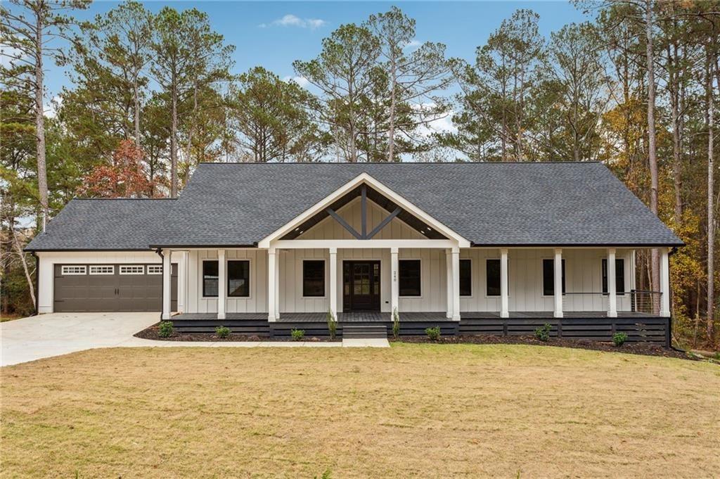 a front view of a house with yard