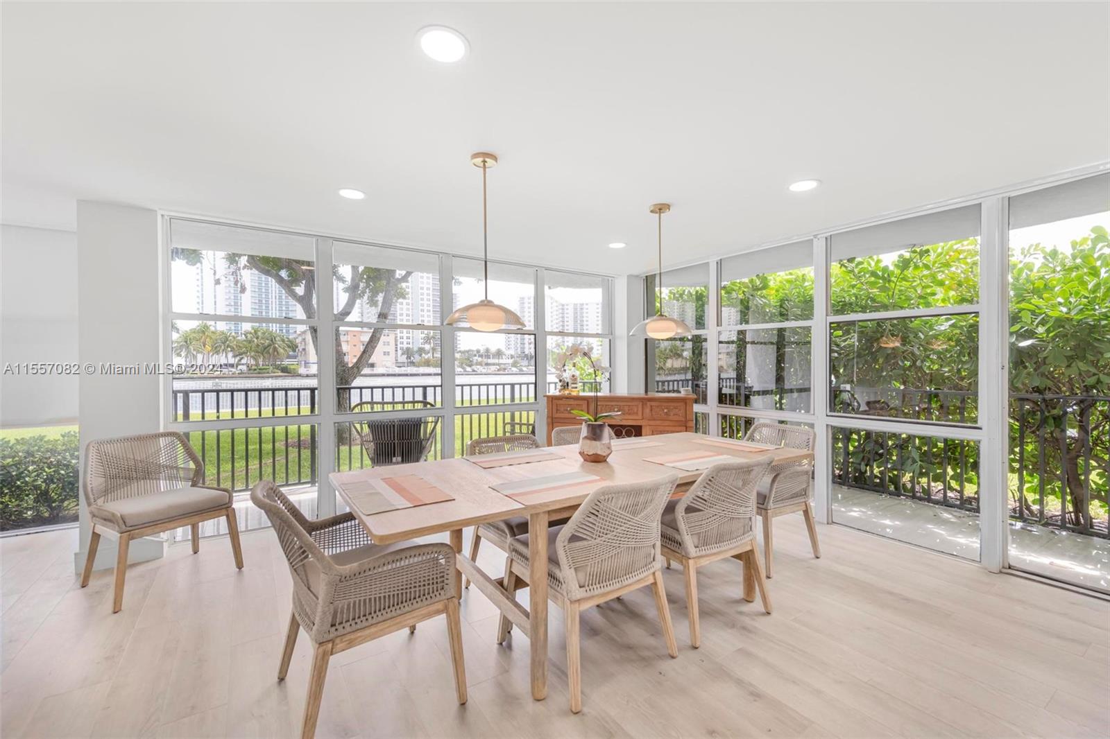 a view of a dining room with furniture window and outside view