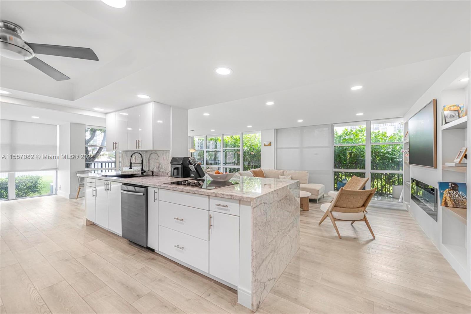 a kitchen with a sink and chairs