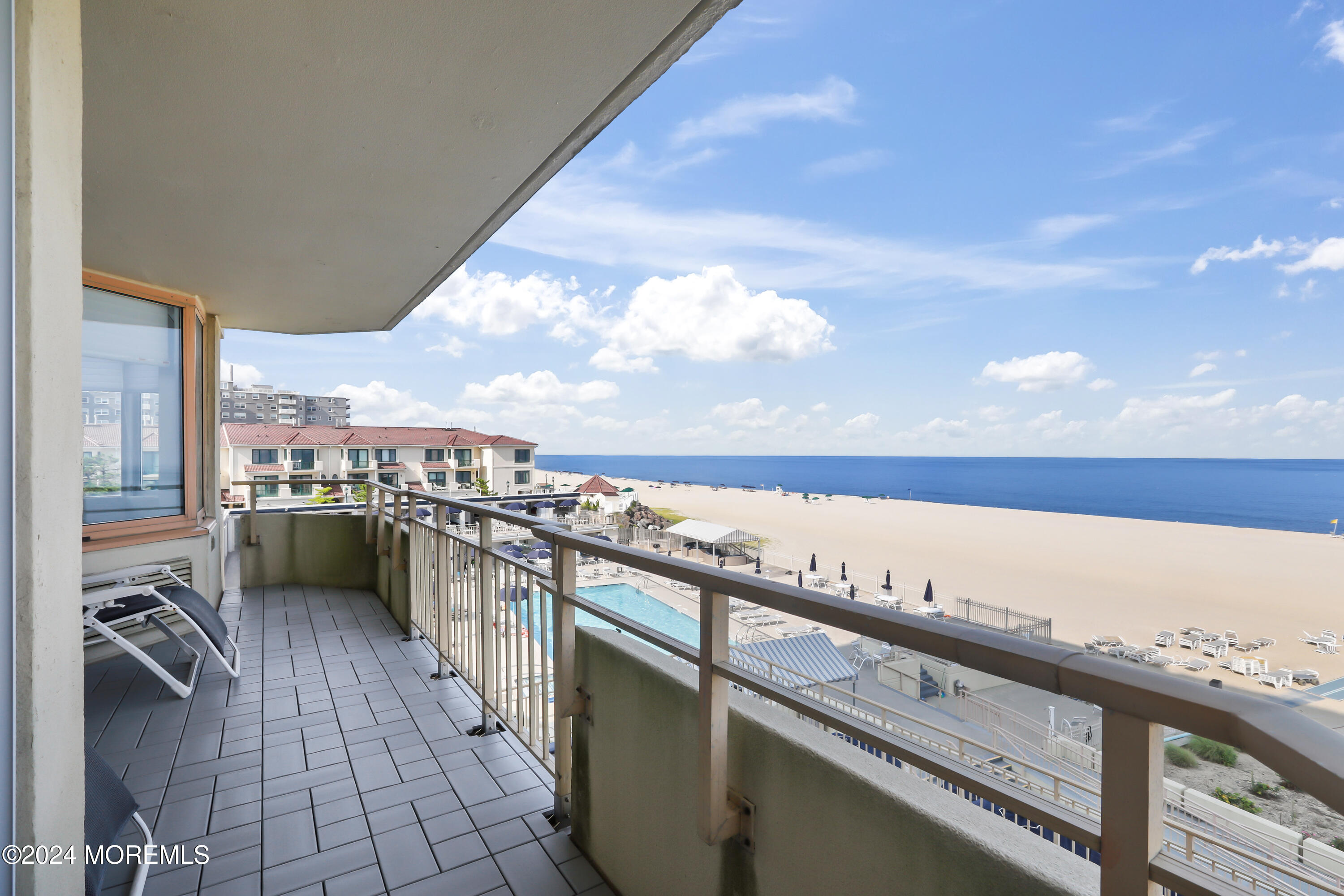 a view of balcony with furniture