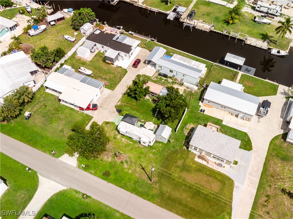 an aerial view of a house with a yard and garden