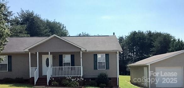 a aerial view of a house with a porch