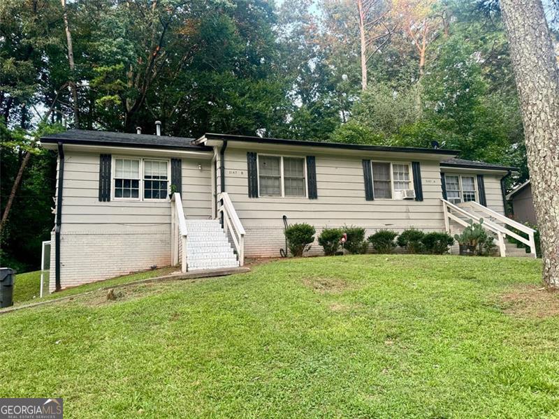 front view of a house that has a yard