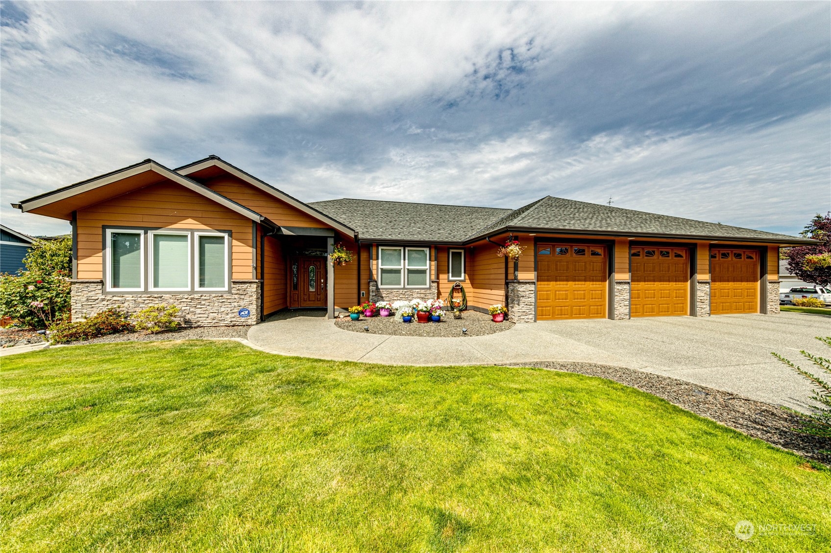 a front view of a house with yard patio and fire pit