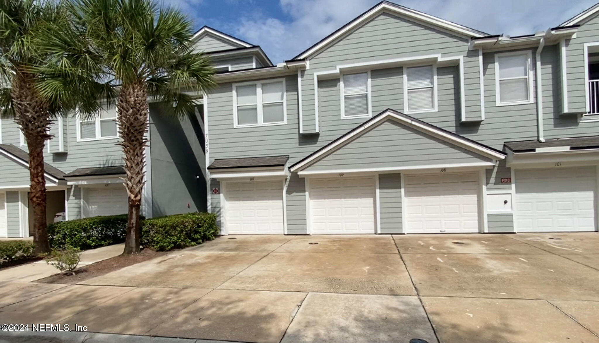 a house with a yard and garage