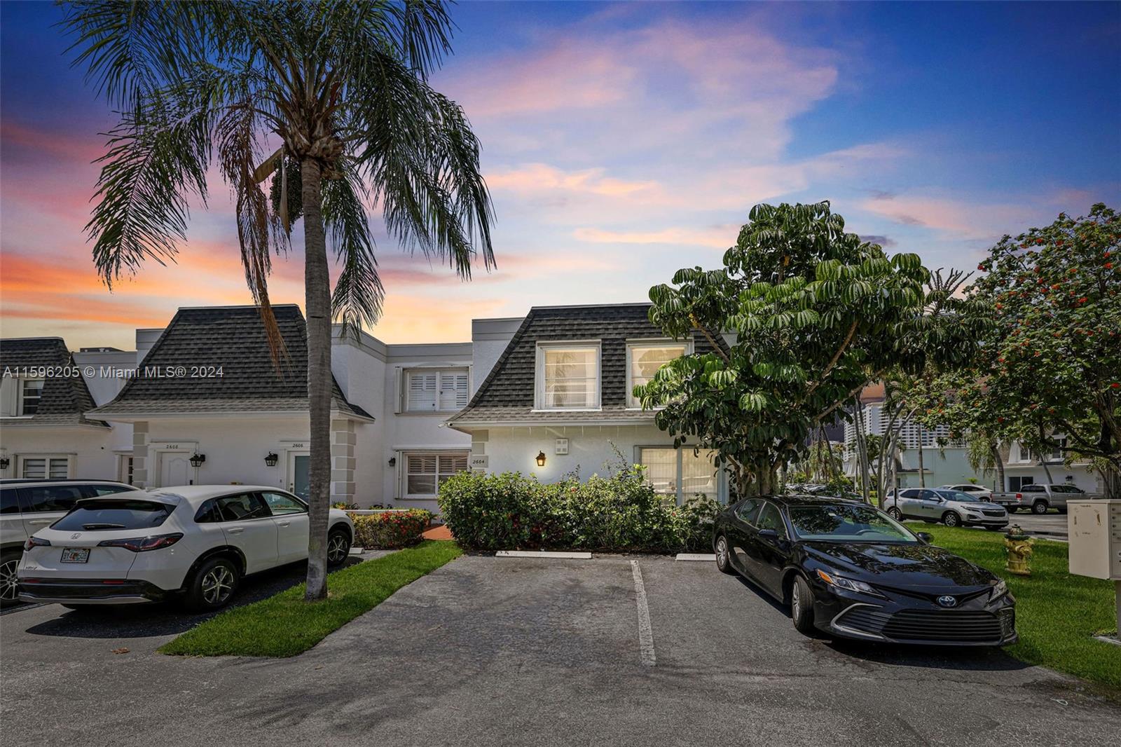 a view of multiple houses with a yard