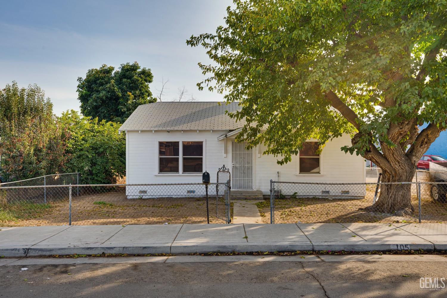 a house view with a swimming pool next to a yard